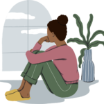 A woman looking out a window, feeling lonely