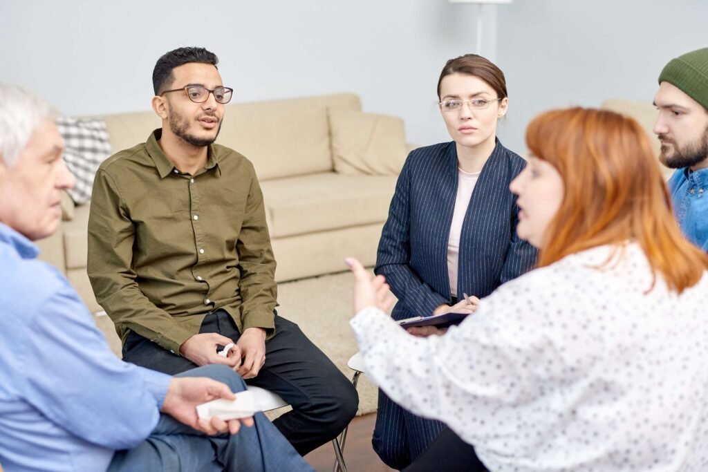 An older adult and family members meeting with a capacity assessor at home
