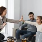 A South Asian family talking together in a family therapy session